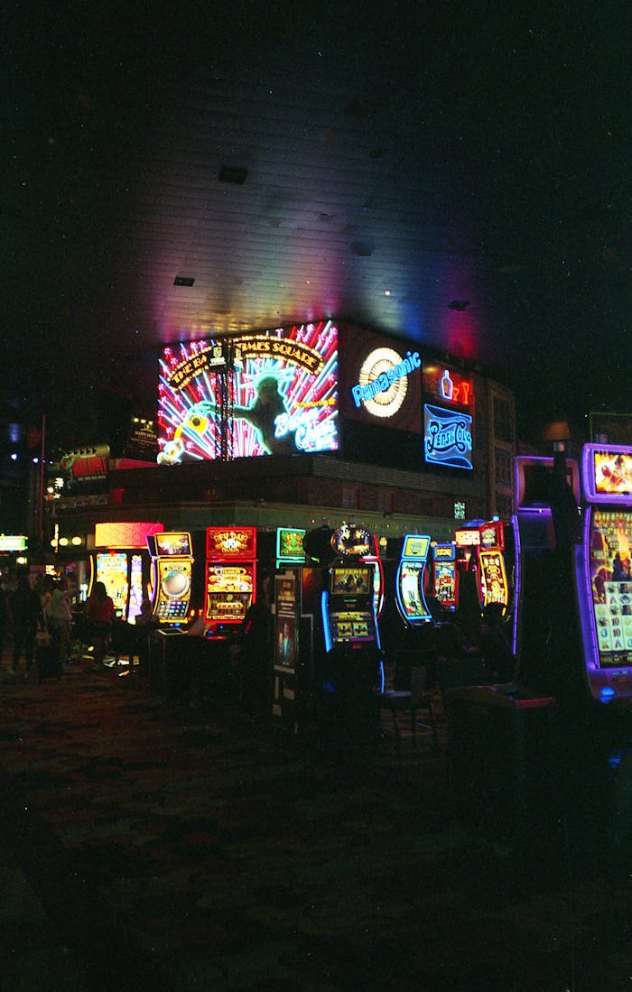 Vibrant Las Vegas casino scene filled with colorful neon lights and slot machines at night.