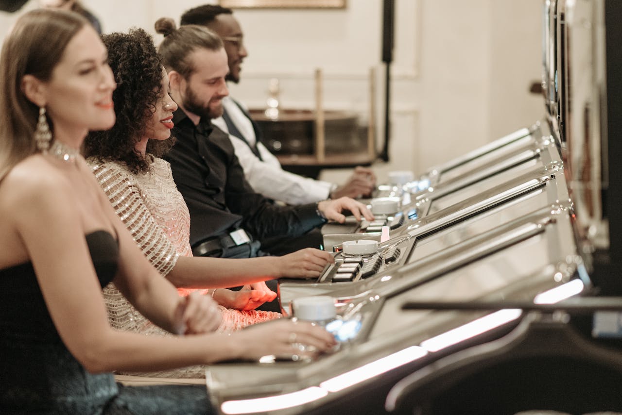 A diverse group of adults sitting at slot machines, experiencing excitement in a casino environment.